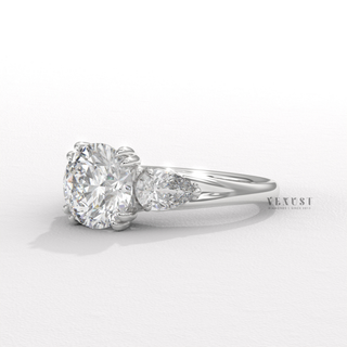 Round brilliant cut moissanite ring with side stones