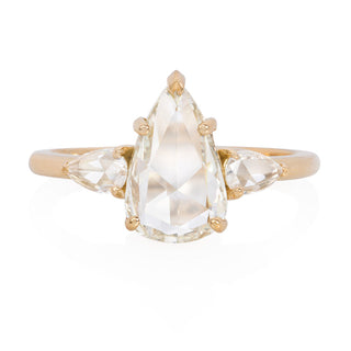 three stone moissanite engagement ring pear center view