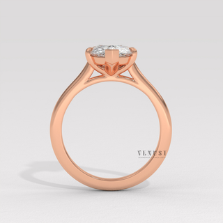 Rose gold pear cut moissanite ring on hand