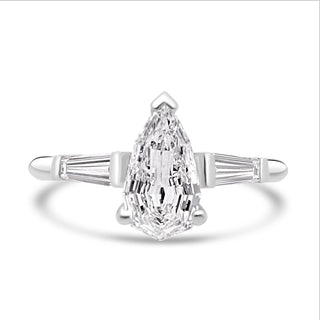 three stone moissanite engagement ring pear step cut view