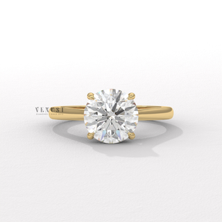 Detailed setting shot of a round brilliant moissanite engagement ring with a hidden halo and cathedral setting
