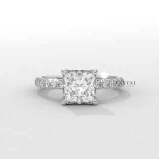 Lifestyle photo of a princess cut moissanite engagement ring with a hidden halo and pave band on the hand