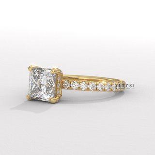 Profile shot of a princess cut moissanite engagement ring with a hidden halo and pave band and its band