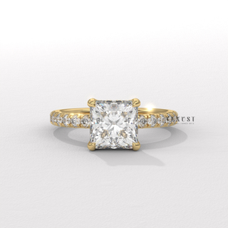 Centre-stone close-up of a princess cut moissanite engagement ring with a hidden halo and pave band