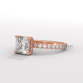 Full view of a princess cut moissanite engagement ring with a hidden halo and pave band with band detail