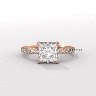 Low-angle view of a princess cut moissanite engagement ring with a hidden halo and pave band