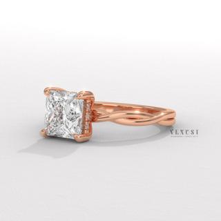 Front view of a princess cut moissanite engagement ring on an infinity band