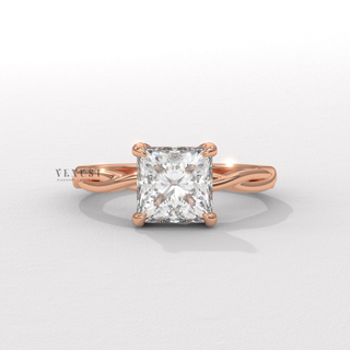 Lifestyle photo of a princess cut moissanite engagement ring on an infinity band on the hand