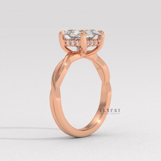 Close-up of a princess cut moissanite engagement ring on an infinity band