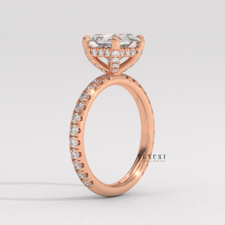 Top-down view of a princess cut moissanite engagement ring with a hidden halo and pave band