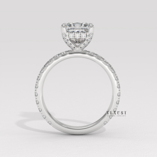 Princess cut moissanite engagement ring with a hidden halo and pave band worn on a hand