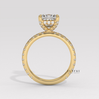 Three-quarter angle of a princess cut moissanite engagement ring with a hidden halo and pave band