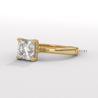 Centre-stone close-up of a princess cut moissanite engagement ring in a hidden halo solitaire setting