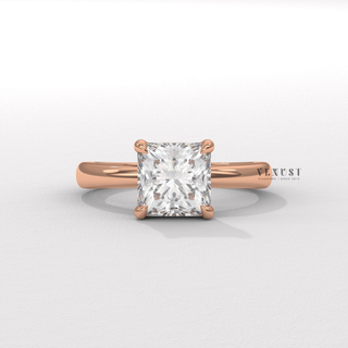 Tilted view of a princess cut moissanite engagement ring in a hidden halo solitaire setting showing its sparkle