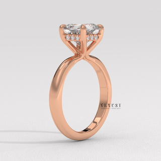 Lifestyle photo of a princess cut moissanite engagement ring in a hidden halo solitaire setting on the hand