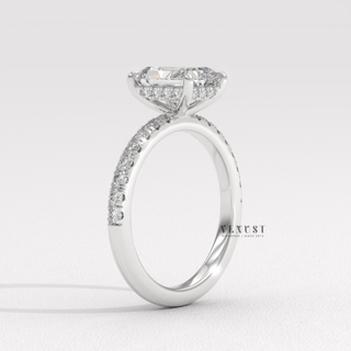 Low-angle view of a radiant cut moissanite engagement ring with a pave band
