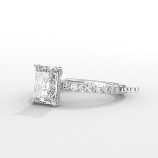 Hand model wearing a radiant cut moissanite engagement ring with a pave band