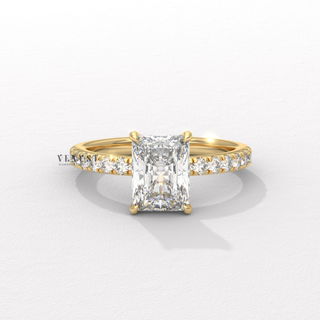 Radiant cut moissanite engagement ring with a pave band shown on a finger