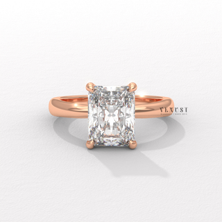 Hand model wearing a radiant cut moissanite engagement ring in a hidden halo solitaire setting