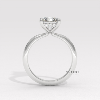 Close-up of a radiant cut moissanite engagement ring in a hidden halo solitaire setting