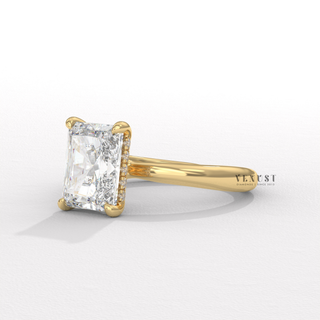 Centre-stone close-up of a radiant cut moissanite engagement ring in a hidden halo solitaire setting