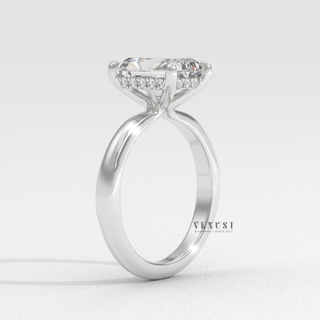 Front view of a radiant cut moissanite engagement ring in a hidden halo solitaire setting