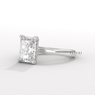 Lifestyle photo of a radiant cut moissanite engagement ring in a hidden halo solitaire setting on the hand