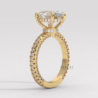 Side profile of a oval cut moissanite engagement ring with a hidden halo and pave band