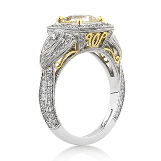 Yellow cushion three stone moissanite engagement ring stone detail view
