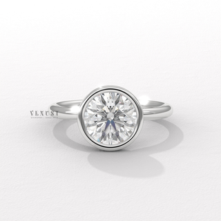 Round cut moissanite ring with bezel setting