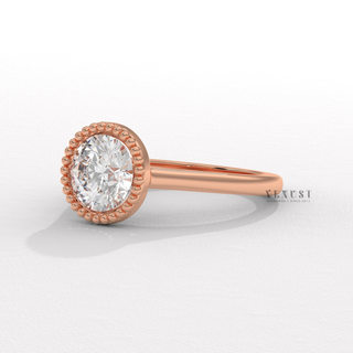 Round cut engagement ring with bold bezel detail