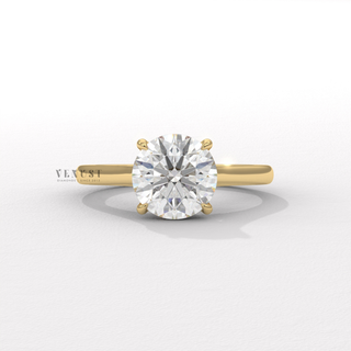 Round cut moissanite engagement ring with a hidden halo and cathedral setting shown on a finger