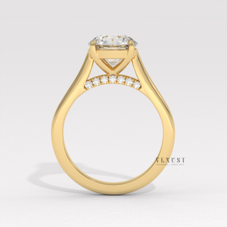 Profile shot of a round cut moissanite engagement ring with a hidden halo and cathedral setting and its band