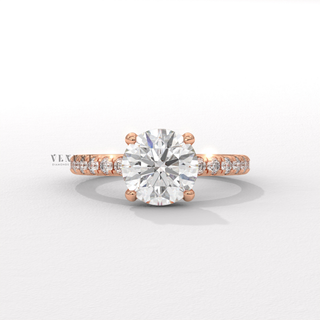 Full view of a round cut moissanite engagement ring with a hidden halo and pave band with band detail