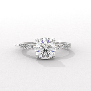 Brilliant cut moissanite ring with pave setting