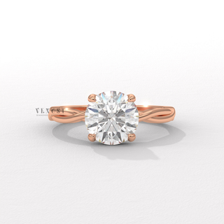 Lifestyle photo of a round cut moissanite engagement ring on an infinity band on the hand