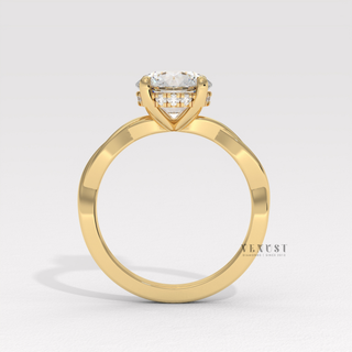Round cut moissanite engagement ring on an infinity band worn on a hand