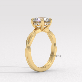 Three-quarter angle of a round cut moissanite engagement ring on an infinity band