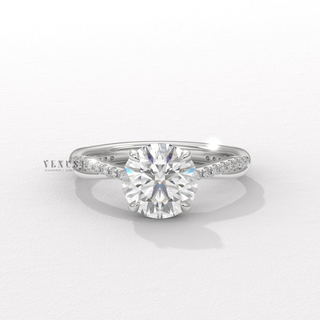 Round brilliant moissanite engagement ring with infinity detail