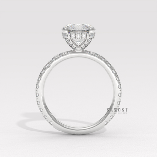 Overhead close-up of a round cut moissanite engagement ring with a hidden halo and pave band