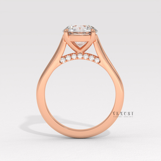 Full view of a round cut moissanite engagement ring with a hidden halo and cathedral setting with band detail