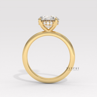 Hand model wearing a round cut moissanite engagement ring in a solitaire setting
