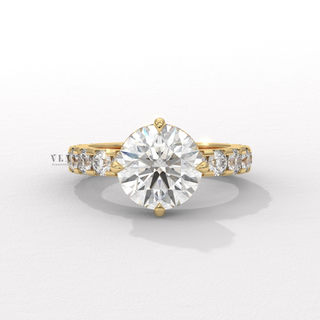Tilted view of a round cut moissanite engagement ring with a hidden halo and pave band showing its sparkle