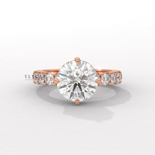 Detailed setting shot of a round cut moissanite engagement ring with a hidden halo and pave band