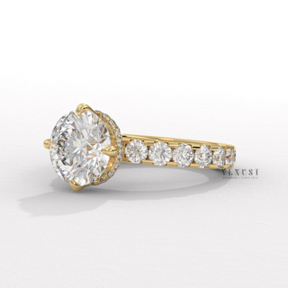 Studio shot of a round cut moissanite engagement ring with a hidden halo and pave band on a plain backdrop