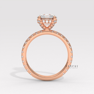 Round cut moissanite engagement ring with a hidden halo and pave band shown on a finger