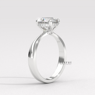 Profile shot of a round cut moissanite engagement ring in a hidden halo solitaire setting and its band
