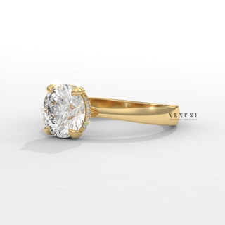 Hand model wearing a round cut moissanite engagement ring in a hidden halo solitaire setting