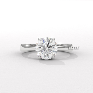 Detailed setting shot of a round cut moissanite engagement ring in a hidden halo solitaire setting