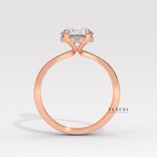 Front view of a round cut moissanite engagement ring in a hidden halo solitaire setting